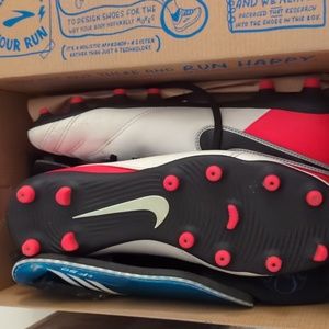 Nike red and white women's soccer cleats tiempo